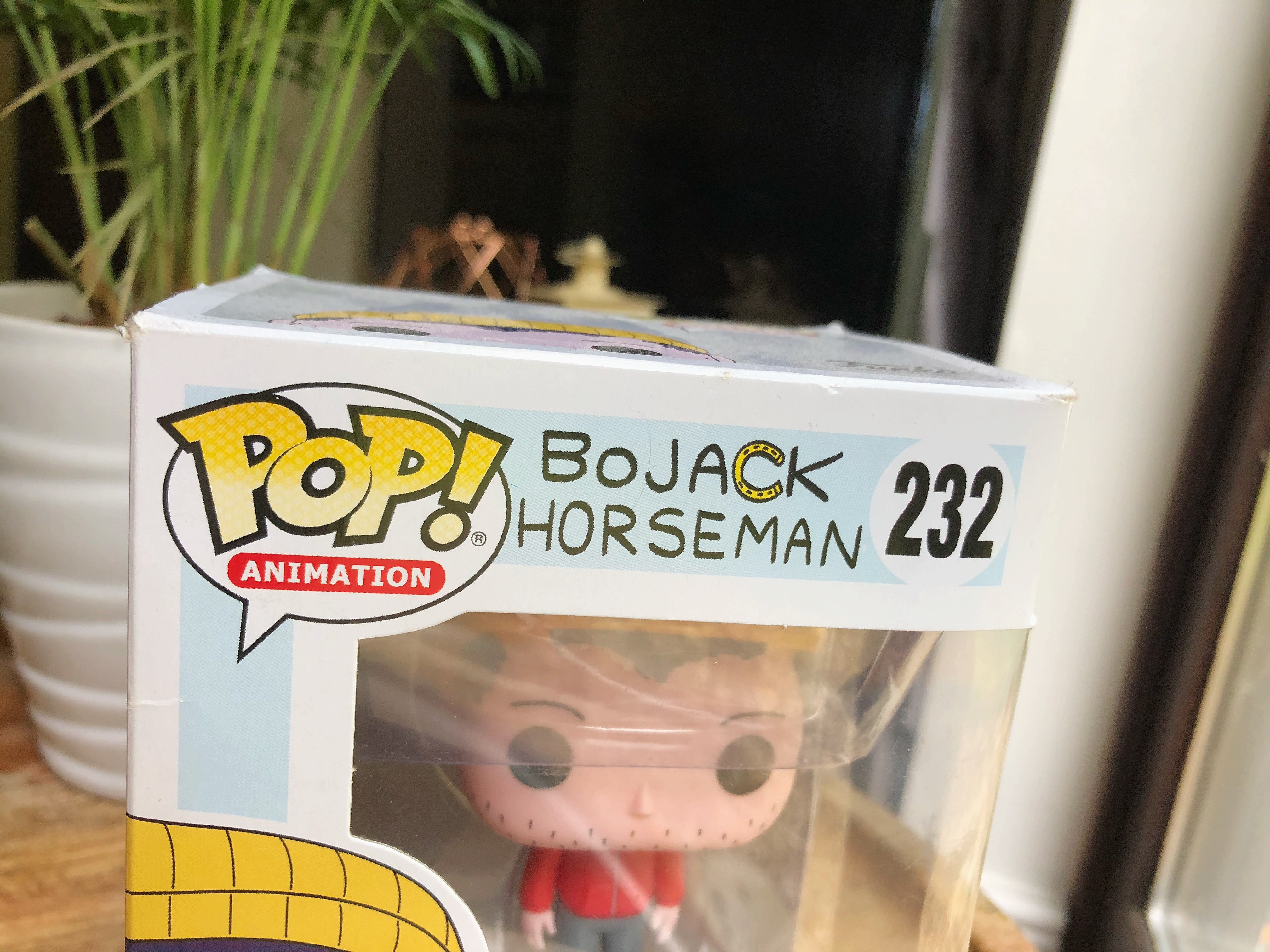  A collectible figurine from the show showcasing the Bojack Horseman typography